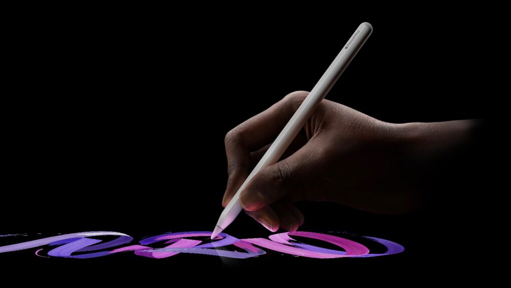 A close-up photo of a person's hand using an Apple Pencil Pro to write on an iPad, used to illustrate a post on an Apple Pencil Pro deal.