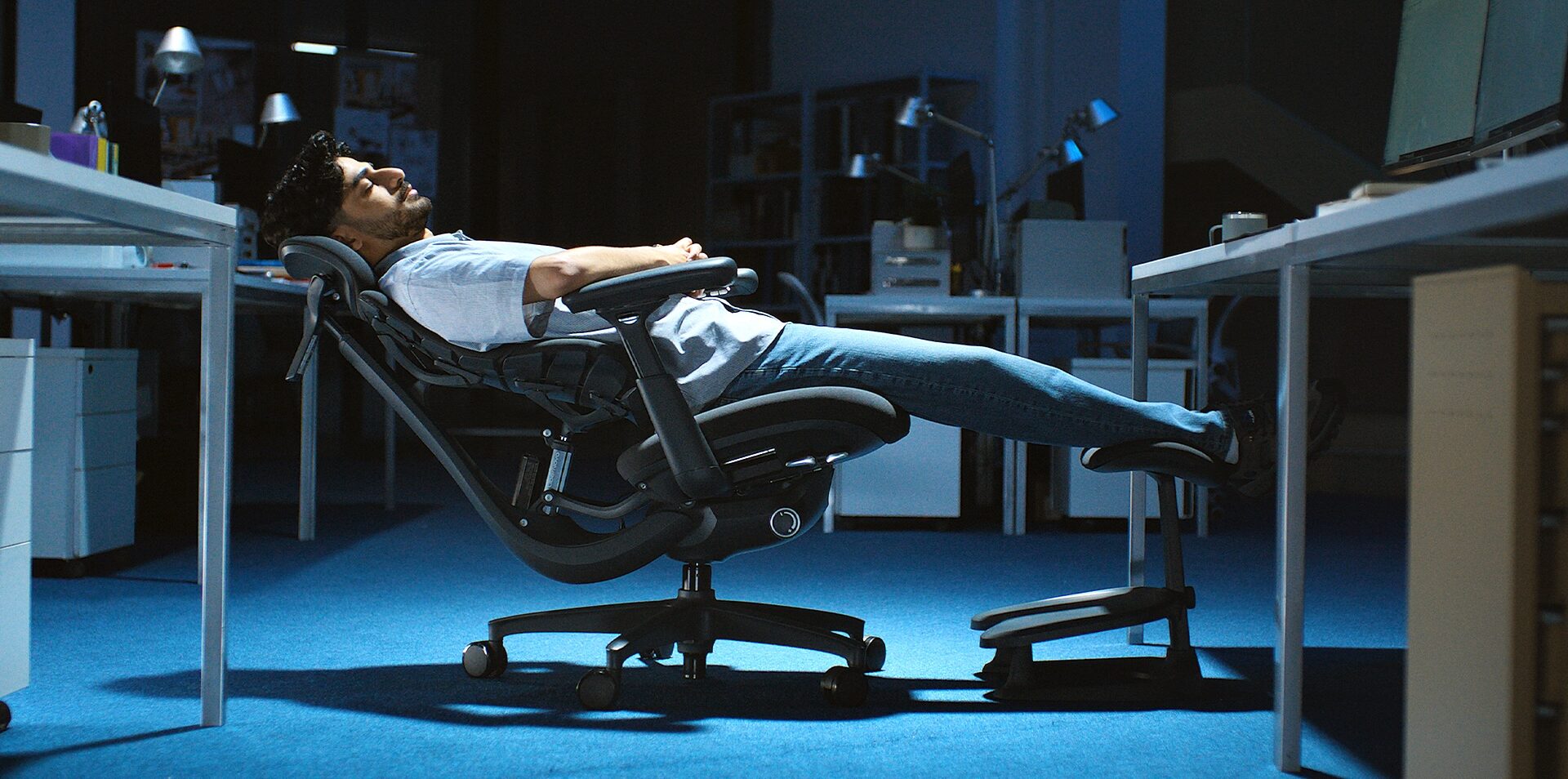 Person reclining in a LiberNovo Omni ergonomic chair